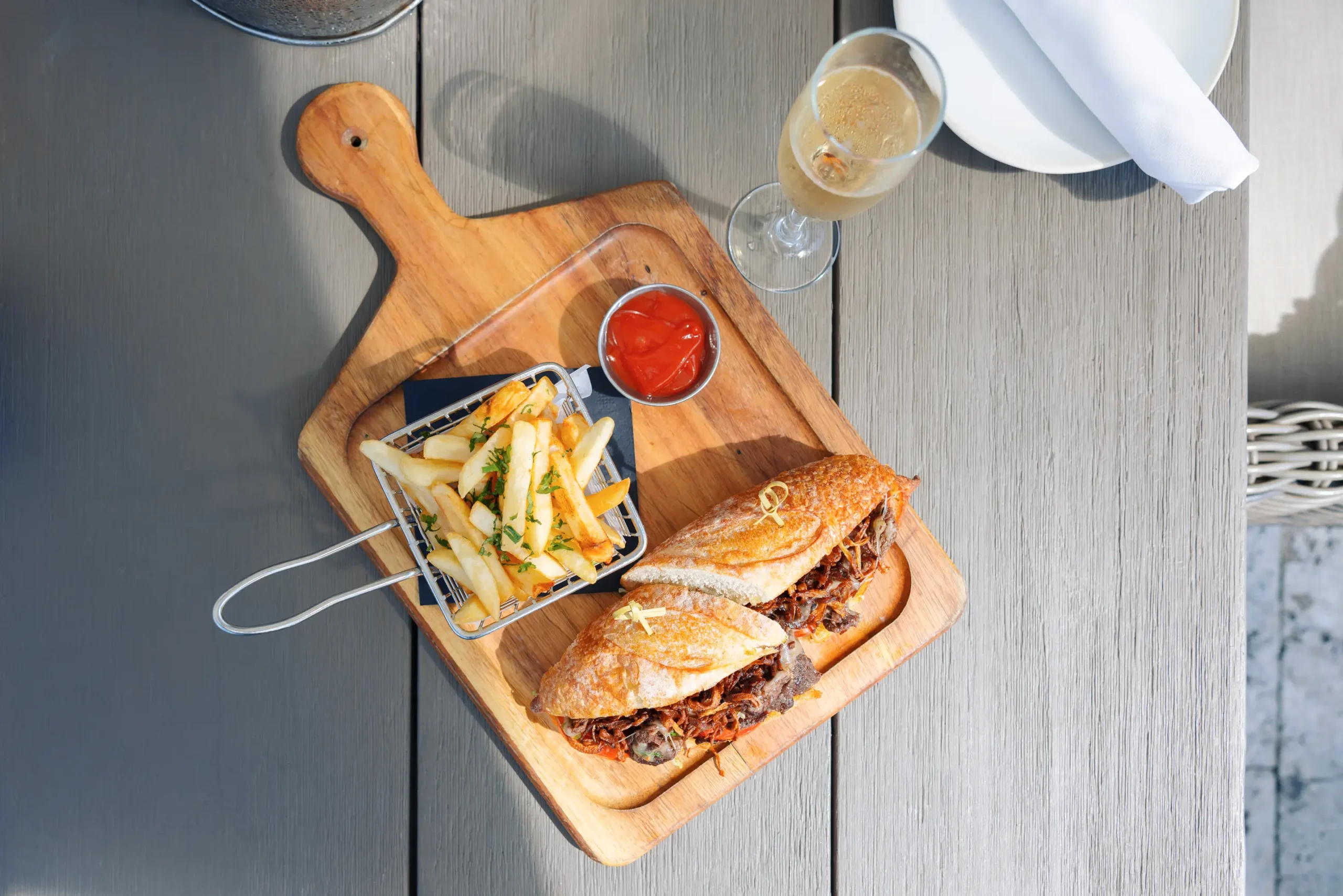 Pulled beef baguette with champagne at The Deck at Island Gardens